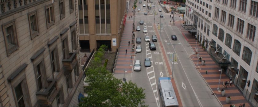 Aerial view of car chase on city street.