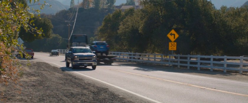 A blue pickup on a small country road in New Jersey.