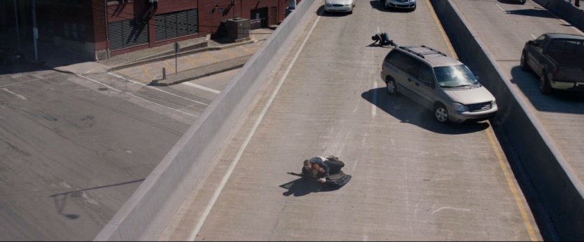 High angle view of characters laying on freeway overpass.
