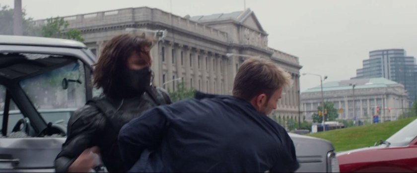 Steve Rogers fight the Winter Soldier in a street.