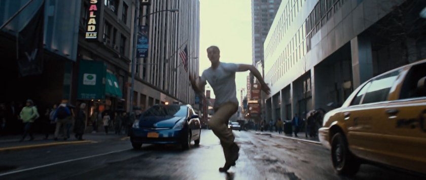 Steve Rogers running through modern New York street.