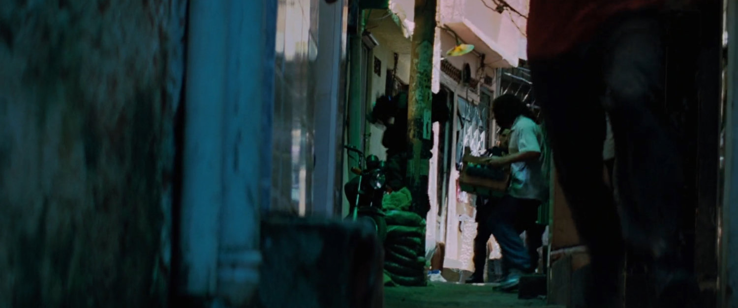 A tight favela alleyway.