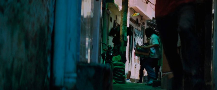 A tight favela alleyway.