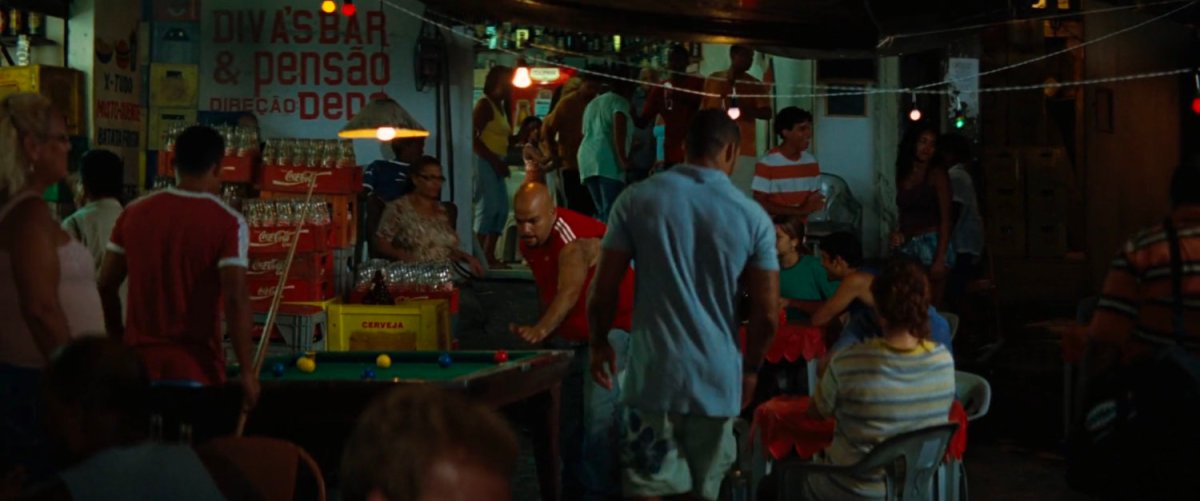 A crowd gathered at a favela cafe.