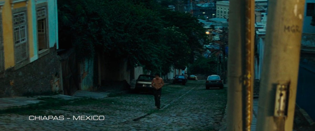 Bruce Banner walks up a steep cobblestone street. Text: Chiapas Mexico.
