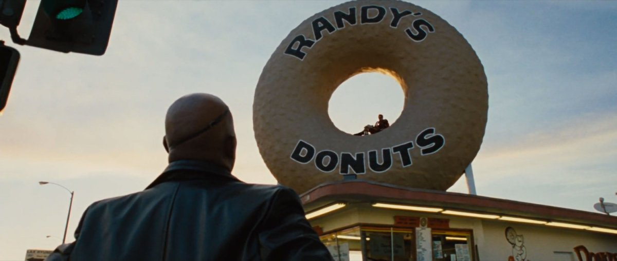 Exterior of Randy's Donuts with Nick Fury speaking to Iron Man.