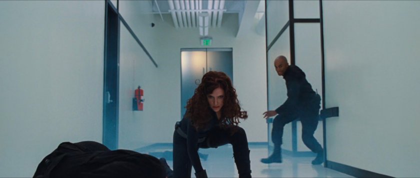 Natasha Romanoff in Hammer Industries hallway.