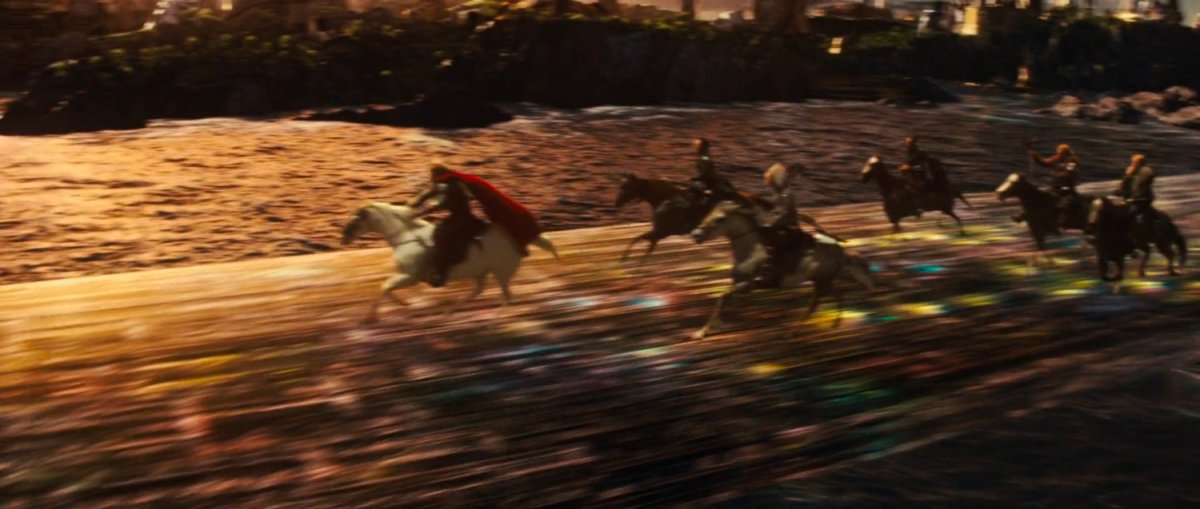 Horses riding across Bifrost, the Rainbow Bridge.
