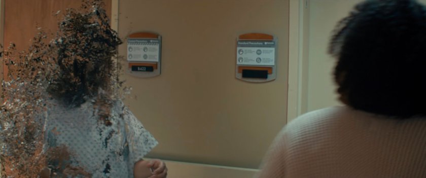 A woman returns from the Blip in a hospital corridor.