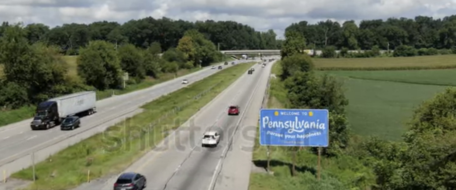 Stock footage still of Highway with Welcome to Pennsylvania sign.