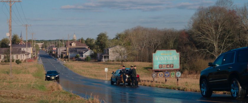 Police car stopping oncoming traffic from entering town of Westview.