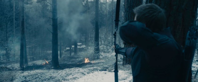 Hawkeye takes aim at a bunker in snowy woods.