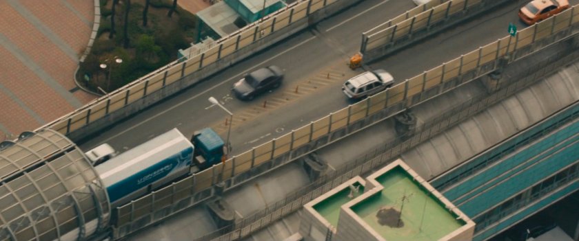Aerial view of U-Gin truck on bridge.