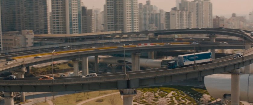 Aerial view of U-Gin truck on bridge cloverleaf.