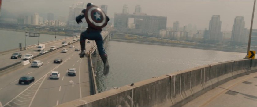 Captain America leaping off bridge to road below.