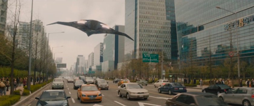 Quinjet hovering over traffic on Seoul Korea street.