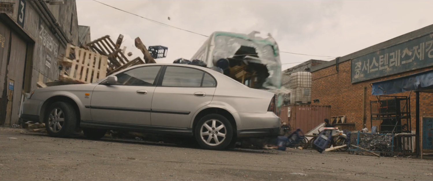 Speeding train jumps off tracks and races through pedestrian street, hitting car.