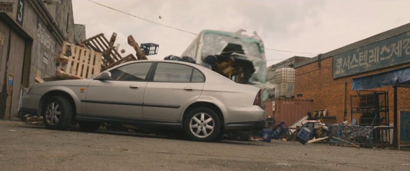 Speeding train jumps off tracks and races through pedestrian street, hitting car.