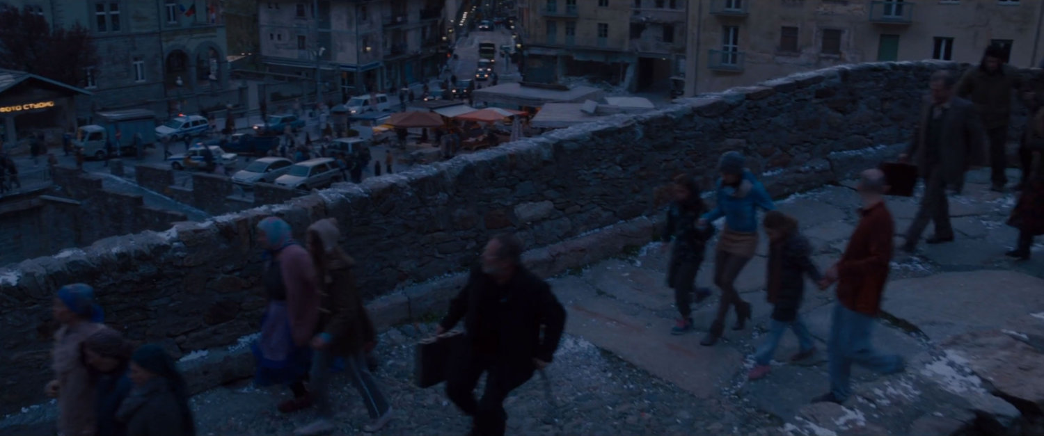 Civilians evacuate over Novi Grad bridge.