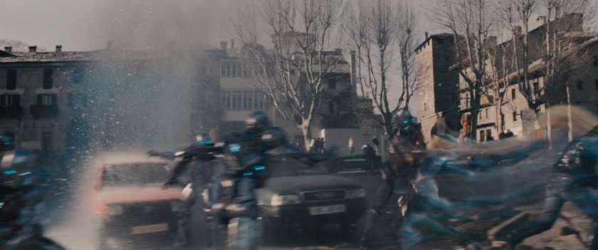 Quicksilver detsroys Ultron drones in a parking lot.