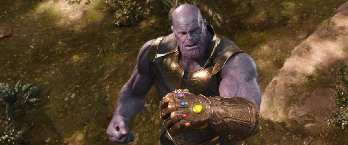 Thanos flexes wearing the Infinity Gauntlet.