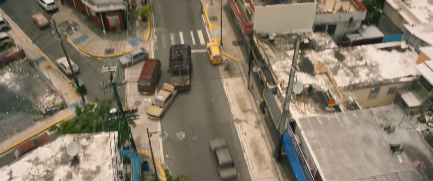 Aerial view of APC crashing into car on Lagos street.