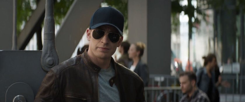 Steve Rogers in disguise on a patio outside a bar.