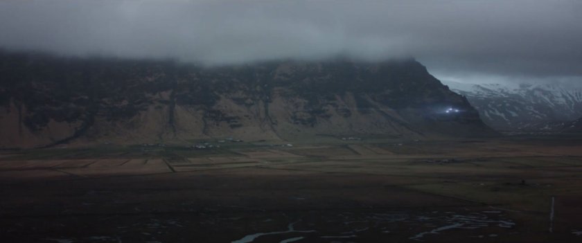 A quinjet streaks across an overcast landscape in Siberia.