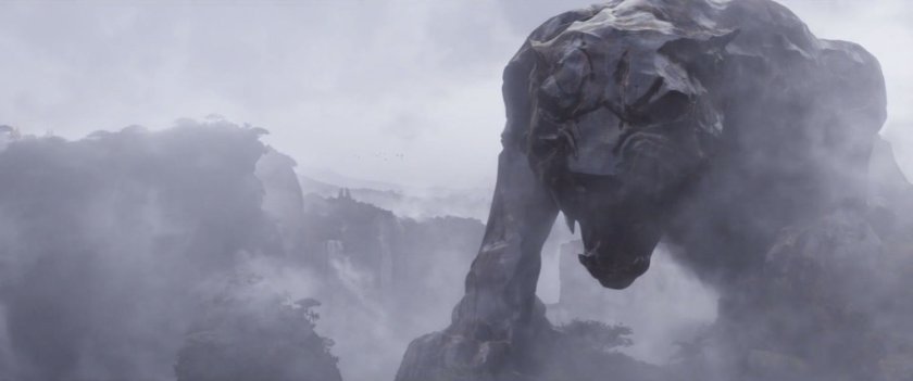 The misty mountains of Wakanda with a giant stone Panther in the foreground.