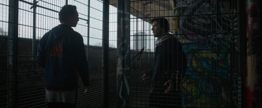 Stephen Strange confronts Jonathan Pangborn at an urban basketball court.