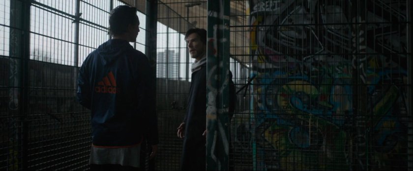 Stephen Strange confronts Jonathan Pangborn at an urban basketball court.