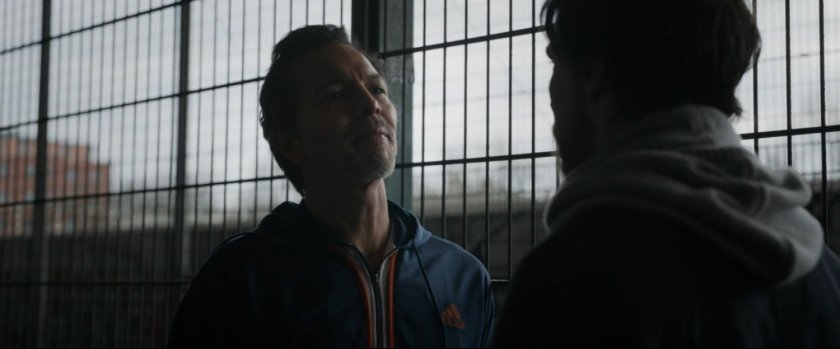 Stephen Strange confronts Jonathan Pangborn at an urban basketball court.