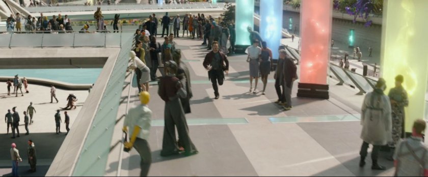Peter Quill runs along a walkway in a Xandar plaza.