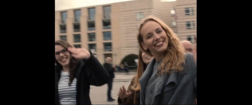 Two women near the Brandenburg gate.