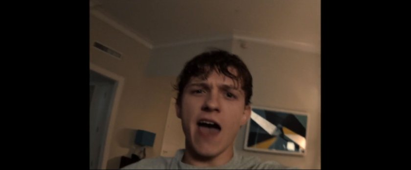 Close up of Peter Parker in a hotel room.