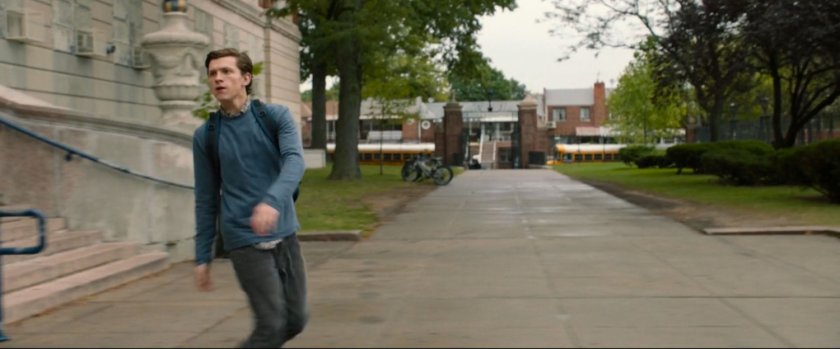 Peter Parker in front of steps to Midtown High.