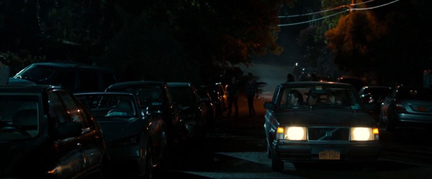 Cars parked on street out in front of Liz's house.