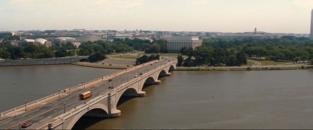 Aerial view of school bus on Arlington Memorial Bridge heading into Washington DC.
