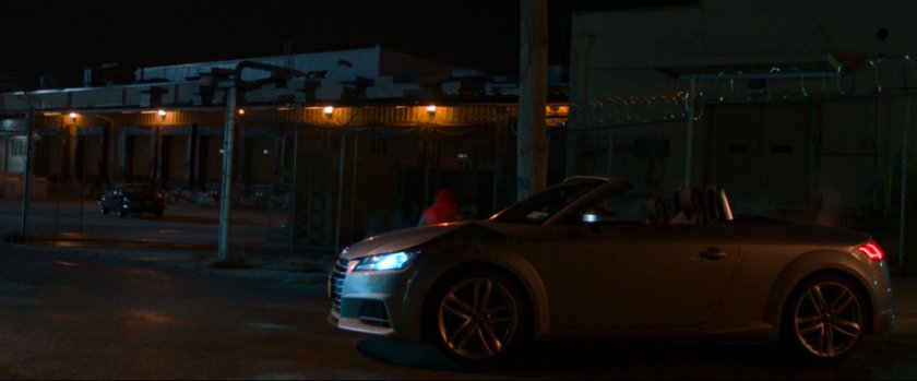 Car parked by entrance to Toomes' Warehouse.