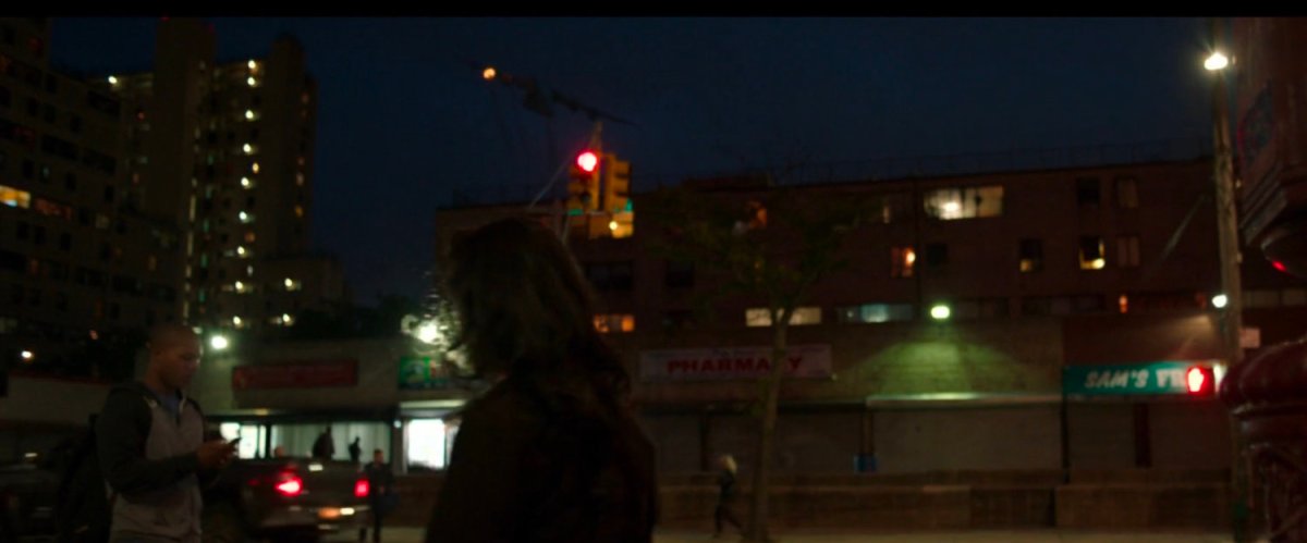 A stark airplane falls out of the sky over New York buildings.