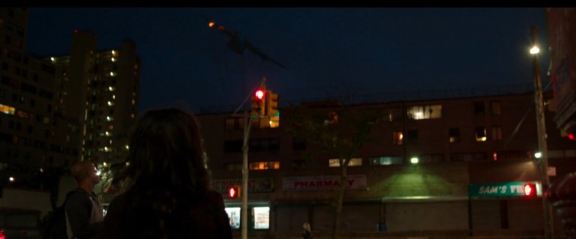 A stark airplane falls out of the sky over New York buildings.