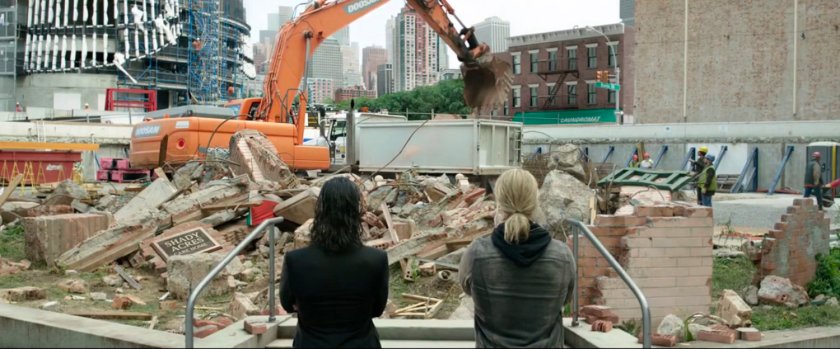 Loki and Thor looking at rubble of torn down building.