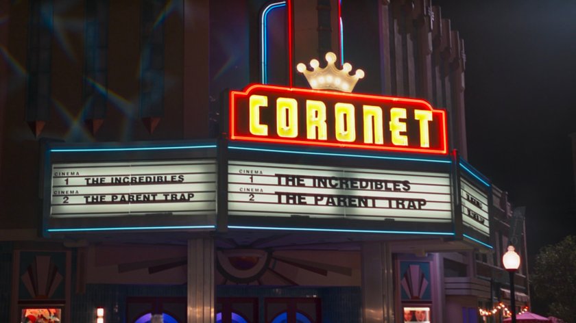 Exterior of Coronet theater with sign advertising The Incredibles and The Parent Trap.