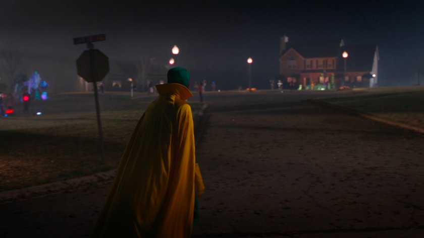 The Vision in costume on a street at nighttime.