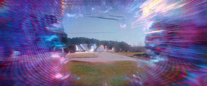 A warping field reveals the edge of the town of Westview in distance.