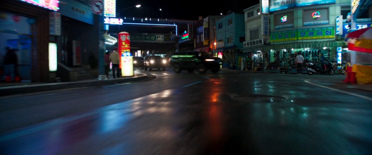 SUVs driving on a Busan street.