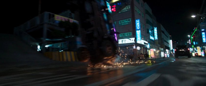 SUV flips over on  Busan street outside seafood market.