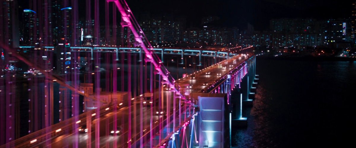 Aerial nighttime view of Gwangan Bridge in Busan.