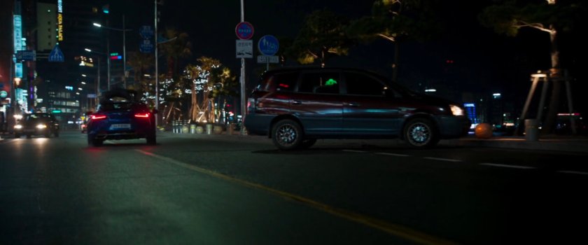 Car with Black Panther on top avoiding crashing into another car on a Busan street.