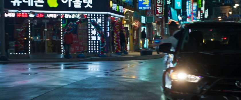 Klaue leaning out of SUV in Busan intersection.